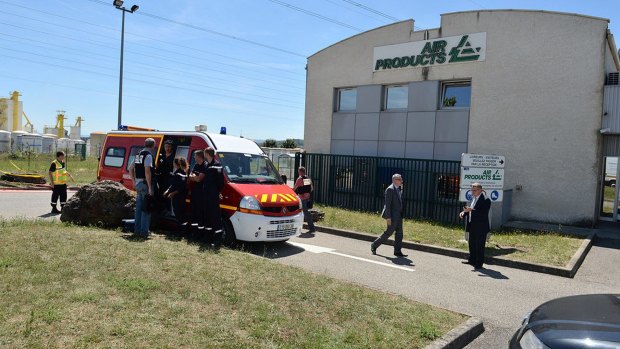 Rescue workers and investigators outside the Air Products gas factory following an attack in Saint-Quentin-Fallavier near Lyon.