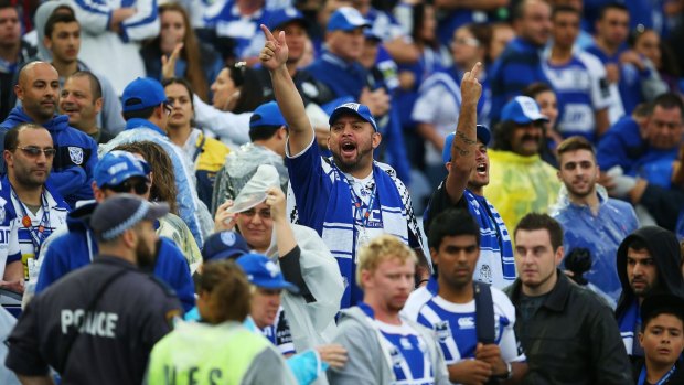 Outraged: Bulldogs fans show their anger at match officials after full-time during the controversial Good Friday clash.