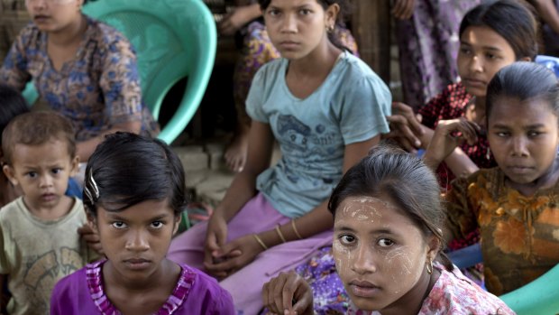 Ethnic Rohingya girls sit at a refugee camp north of Sittwe, western Rakhine state, Myanmar. 