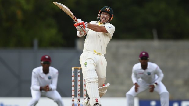 Australia's David Warner hits out as his team chased their victory target of 47 in just five overs to win the first Test against the West Indies in three days.