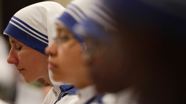 Nuns of Mother Teresa's Missionaries of Charity, pray during a vigil of prayer in preparation for the canonisation of Mother Theresa in the St John in Latheran Basilica at the Vatican.
