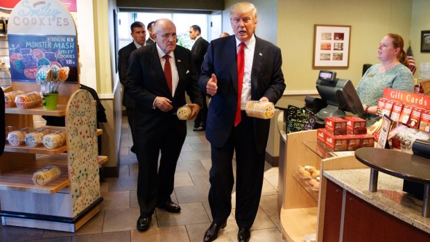 Rudy Giuliani, left, with then-Republican presidential candidate Donald Trump buy cookies in Pennsylvania.