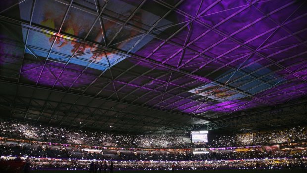 Purple reign: Roof projection to promote the Maddie's Match theme during round 16 at Etihad Stadium.
