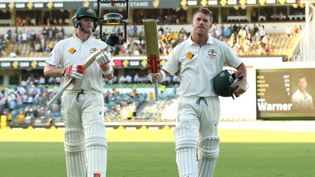 Job well done: Steve Smith and David Warner leave the field at the close of play.