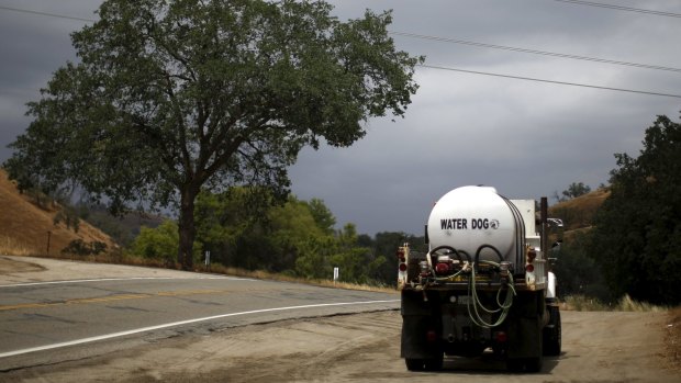 A water truck makes deliveries near Fresno, California. Regulators have implemented statewide rules for the permitting of seawater desalination projects.