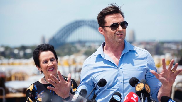 City of Sydney Lord Mayor Clover Moore, with Hugh Jackman, has been criticised by Labor councillor Linda Scott over the cost of the New Year's Eve party at Dawes Point.