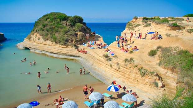 Visit a quiet, secluded beach with 1000 of your close friends in Corfu.