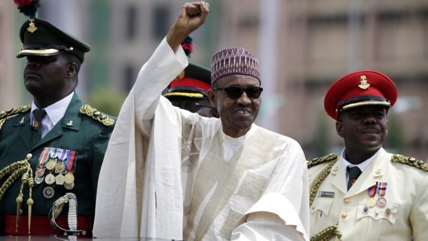 Nigerian President Muhammadu Buhari salutes his supporters in May, in Abuja.