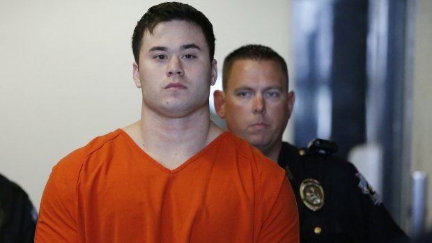 Former Oklahoma City police officer Daniel Holtzclaw (in orange) is accused of sexual offences against 13 women he encountered while on patrol.