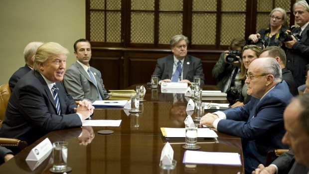 US President Donald Trump, left, meets with cyber security experts in the Roosevelt Room of the White House. Stephen Bannon is at the head of the table.