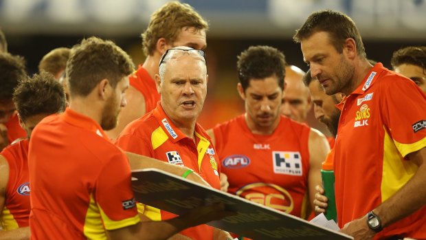 Suns coach Rodney Eade and assistant coach Matthew Primus try to work out a means to avoid going backwards against the Saints.