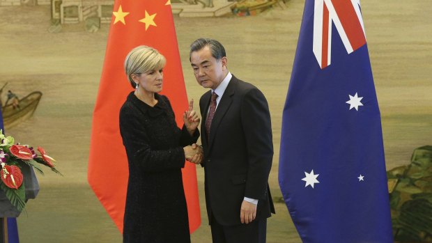 Australian Foreign Affairs Minister Julie Bishop shakes hands with Chinese Foreign Minister Wang Yi in Beijing on February 17. The South China Sea was one topic they discussed. 