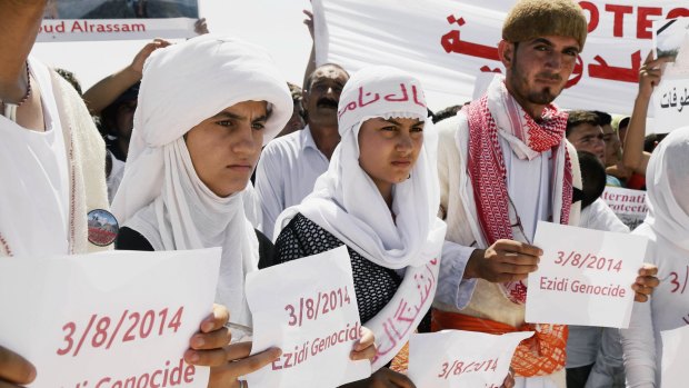 Yazidi Kurds at a protest in Dohuk, Iraq, against the Islamic State's invasion on Sinjar city a year ago.