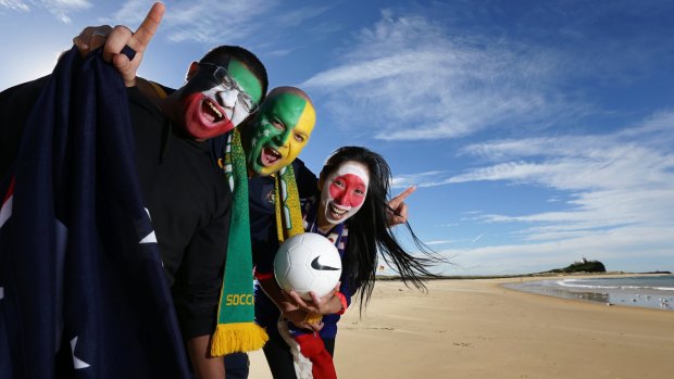 True colours: fans get in the mood at Newcastle's Nobbys Beach.