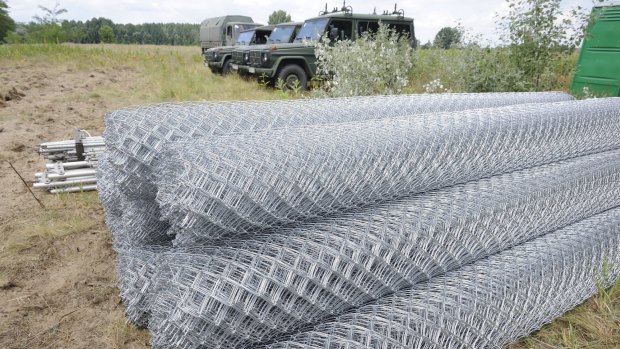 Fence nets are piled up for the building of a fence at the Hungarian-Serbian border near Morahalom.