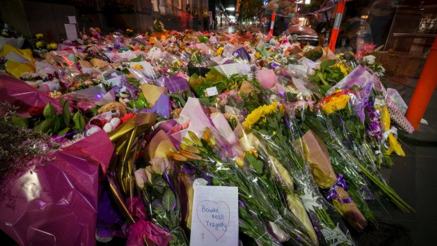 Floral tributes line Bourke Street Mall.