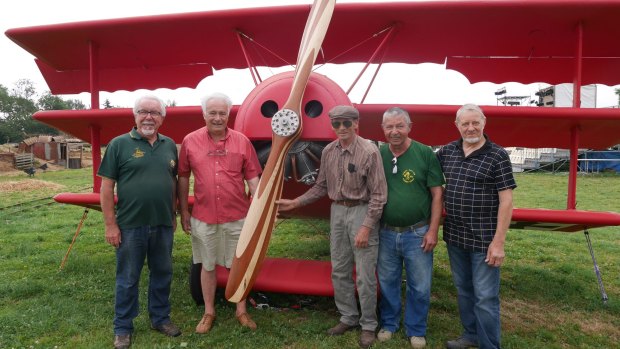 From left:  Yves Potard with Red Baron plane replica artisans Alain Engelaere, Jacky Faude, Jean-Claude Briere and Pierre Thomas.
