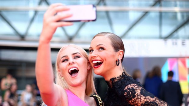 Carissa Walford and Ksenija Lukich take a selfie on the red carpet ahead of the ARIA Awards 2015 at The Star in November. 