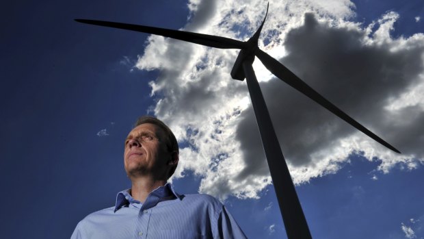 Simon Corbell, pictured at the Acciona wind farm at Gunning last year, says Tony Abbott is public enemy No 1 on renewables.