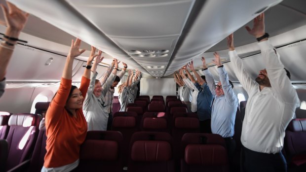 Passengers are taken through some exercises.