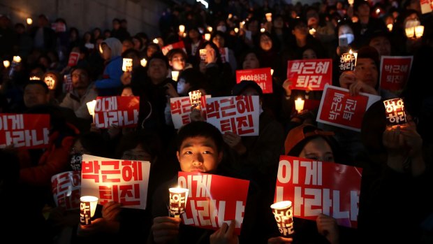 Thousands of South Koreans are demanding the president's resignation.