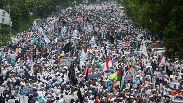 Indonesian Muslims march during a rally against Ahok in December.