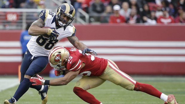 Rams tight end Lance Kendricks (88) is tackled by San Francisco 49ers safety Eric Reid (35) during one of the final matches for St Louis in the NFL. 