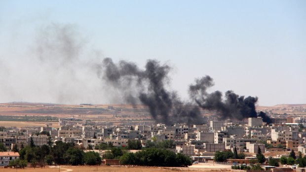 Smoke billows from Kobane on Thursday.