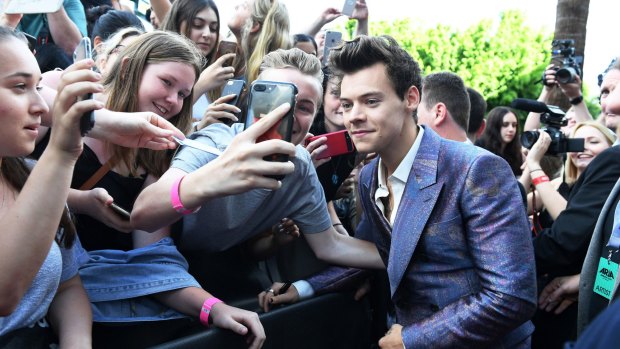 Grin and bear it - Harry Styles on the ARIA red carpet at The Star.