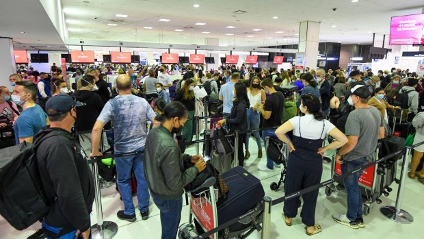 Passengers queue to check-in for at Sydney airports international terminal this week.