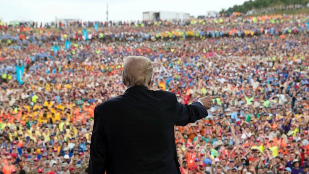 US President Donald Trump interacts with the crowd after speaking at the 2017 National Scout Jamboree in Glen Jean,  West Virginia, on Monday.