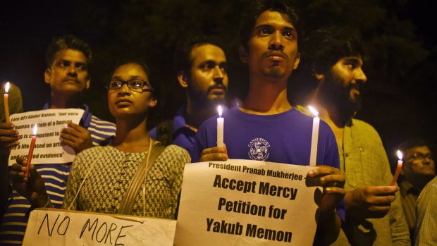 Dozens of Indian activists lit candles and held banners urging the Indian President to stop Memon's scheduled death penalty.