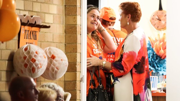 Pauline Hanson consoles a distressed supporter.