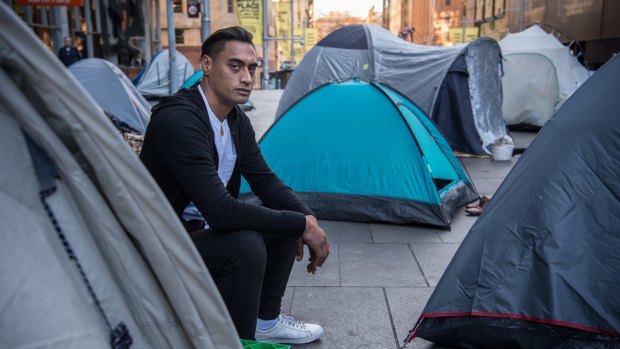 Rewi Waetford in front of his tent at the safe space for homeless in Martin Place, where  a self-determined community is materialising the failure of those in power to carry out their duties. 