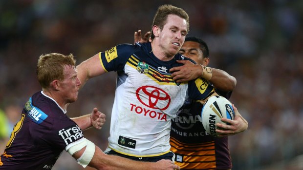 No complacency: Michael Morgan breaks the line for the Cowboys during their thrilling grand final win over Brisbane.