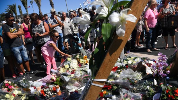 Mourners at the scene of French terror attacks in Nice.