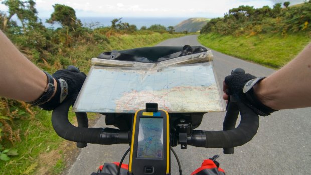 A GPS and map on a bicycle tour along the coast of Exmoor near hunters inn, Devon. 
