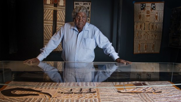 Djambawa Marawili, a Yolngu clan leader and artist with one of his artworks on display at the Australian National Maritime Museum.