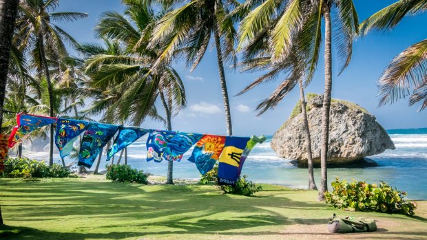 Colourful beach towels swing in the wind on Bathsheba Beach.