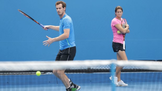 Andy Murray practises at Melbourne Park on Tuesday as his coach, Amelie Mauresmo, watches.