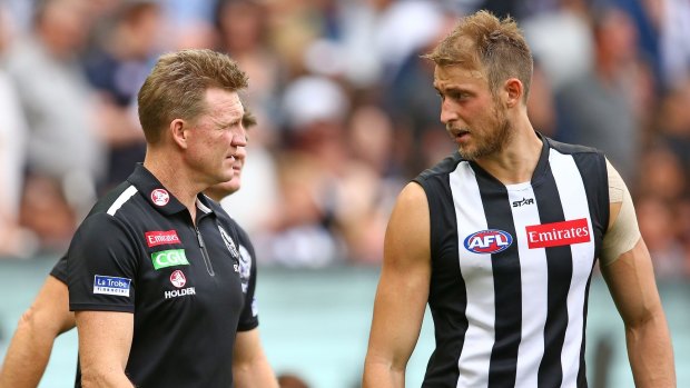 Nathan Buckley has a word to Ben Reid during the match against Carlton.
