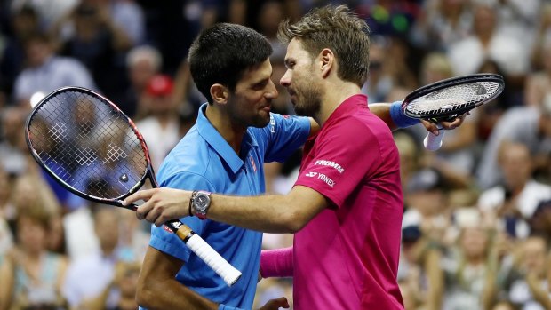 Gracious in defeat: Djokovic congratulates Wawrinka.