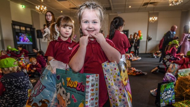 Izzie, from Mahogany Rise Primary School in Frankston North, with her haul of showbags.
