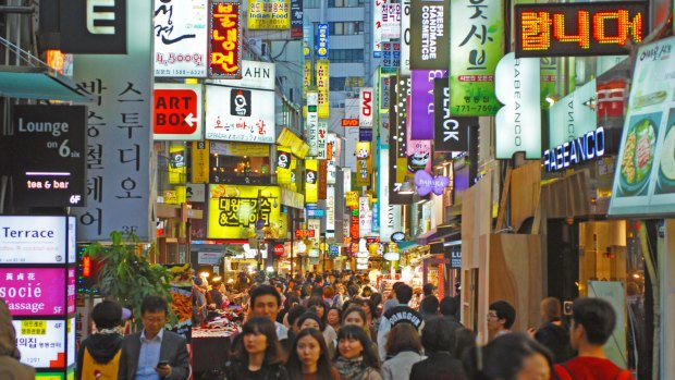 Shoppers and nightlife on the streets of Myeongdong, Seoul.