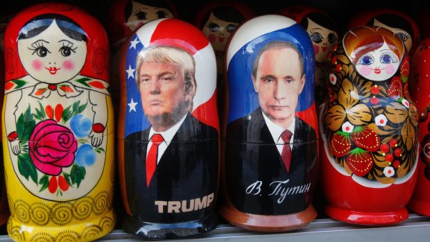 Traditional Russian wooden dolls depicting US President Donald Trump and Russian President Vladimir Putin.