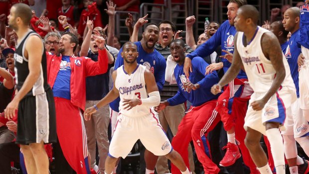 Game winner: Chris Paul and the Clippers bench react after he scored a basket with one second remaining to give his team the win against the San Antonio Spurs.  The Clippers won 111-109 to win the series 4-3.