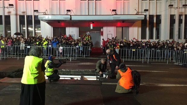 Mike Parr emerges after spending three days buried underneath a road in Hobart.