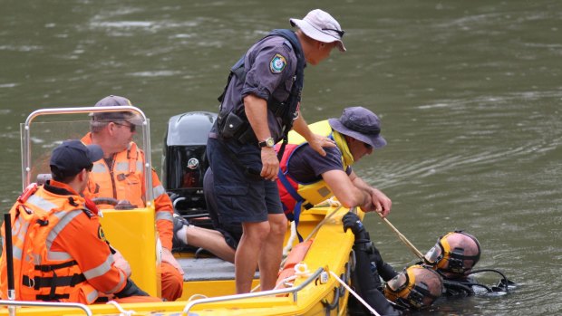 Police divers search the Murrumbidgee River in Wagga on Thursday.