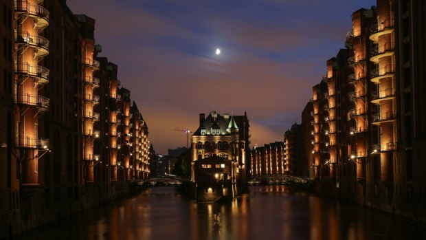The moon shines over the Old Warehouse District in Hamburg, northern Germany. 