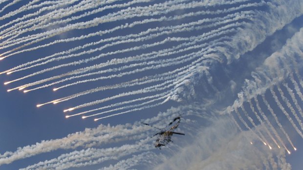 A South Korean army helicopter fires flare shells joint military drills with the US.